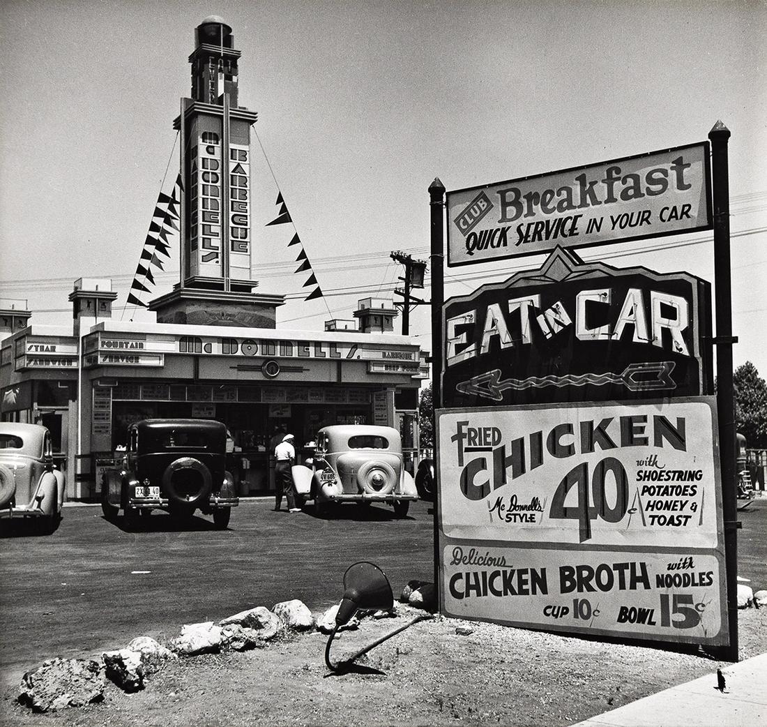 JOHN GUTMANN (1905-1998) Eat in Car * Auto Ferries.: JOHN GUTMANN (1905-1998) Eat in Car * Auto Ferries. Together, 2 photographs. Silver prints, the images measuring 7x8 inches (19x35.6 cm.) and 6x9 inches (17.5x24.1 cm.), the mounts 18x14 inches (45.7x