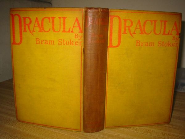 STOKER, BRAM. Dracula.: STOKER, BRAM. Dracula. 8vo, publisher's canary yellow cloth stamped in red, cocked, spine heavily browned, 1/2-inch ink stain to left edge of front cover, split to upper rear joint and center of spine