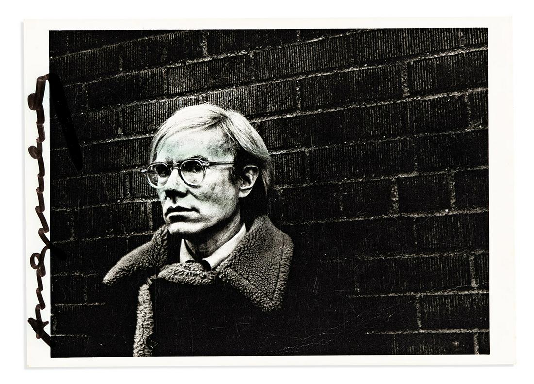 WARHOL, ANDY. Photograph postcard Signed, twice, bust portrait by Pepe Diniz, showing him standing (1 of 2)