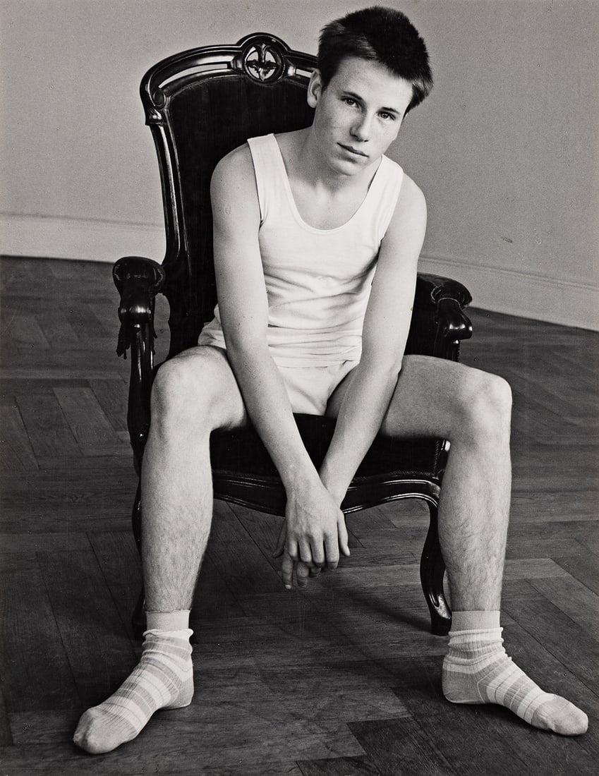 HERBERT LIST (1903-1975) Boy in chair.: HERBERT LIST (1903-1975) Boy in chair. Silver print, the image measuring 292x229 mm; 11½x9 inches, with List's credit and copyright stamps on verso. 1960s.