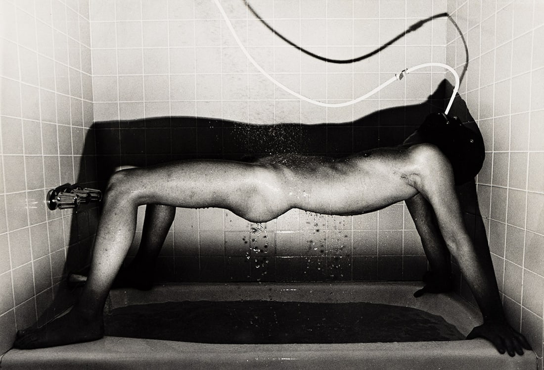 JIMMY DESANA (1949-1990) Enema, from the series Submission.: JIMMY DESANA (1949-1990) Enema, from the series Submission. Silver print, the image measuring 232x340 mm; 9x13 inches, the sheet slightly larger, with DeSana's signature in pencil on verso. 1977-78.Pr