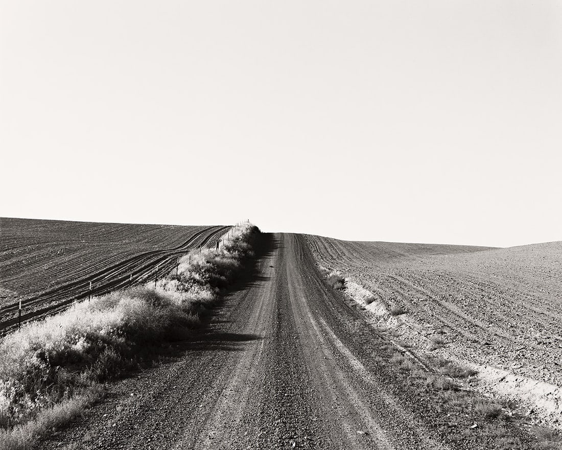 ROBERT ADAMS (1937- ) Near Pendleton, Oregon.: ROBERT ADAMS (1937- ) Near Pendleton, Oregon. Silver print, the image measuring 14½x18 inches (36.8x45.7 cm.), the sheet 16x20 inches (40.6x50.8 cm.), with Adams' signature, date 1994, the title,