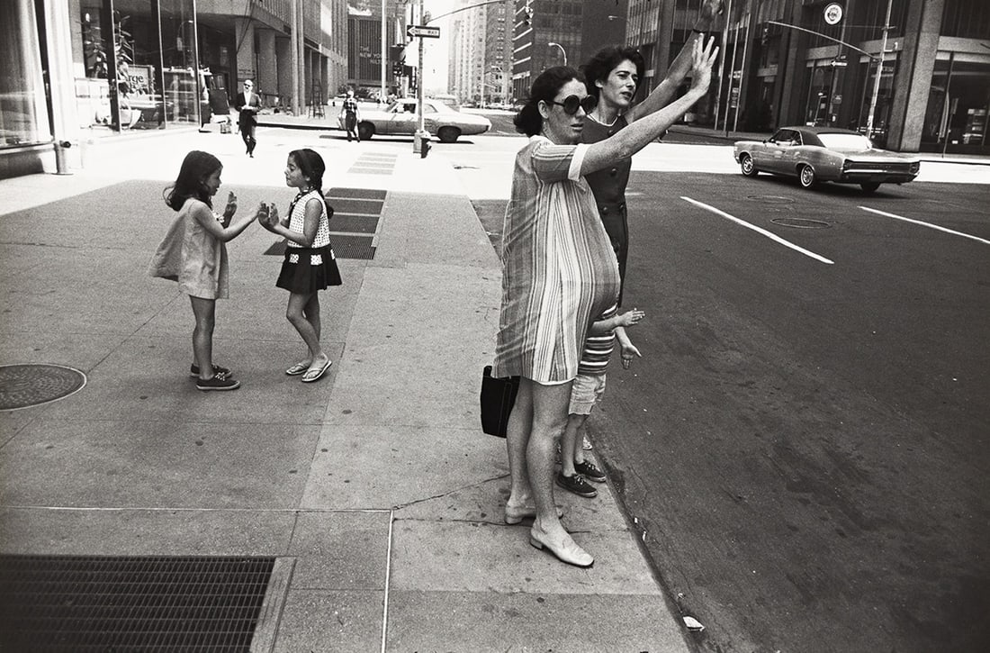 GARRY WINOGRAND (1928-1984) Pregnant woman hailing a cab, New York, from the series Women are: GARRY WINOGRAND (1928-1984) Pregnant woman hailing a cab, New York, from the series Women are Beautiful. Silver print, the image measuring 8x13¼ inches (22.5x33.7 cm.), the sheet 11x14 inches (27