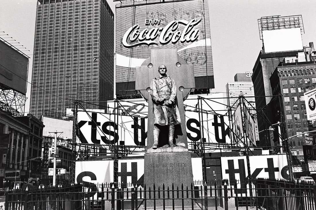 LEE FRIEDLANDER (1934- ) New York City (Father Duffy, Times Square).: LEE FRIEDLANDER (1934- ) New York City (Father Duffy, Times Square). Silver print, the image measuring 8x13 inches (21.9x33 cm.), the sheet 11x14 inches (27.9x35.6 cm.), with Friedlander's signature,