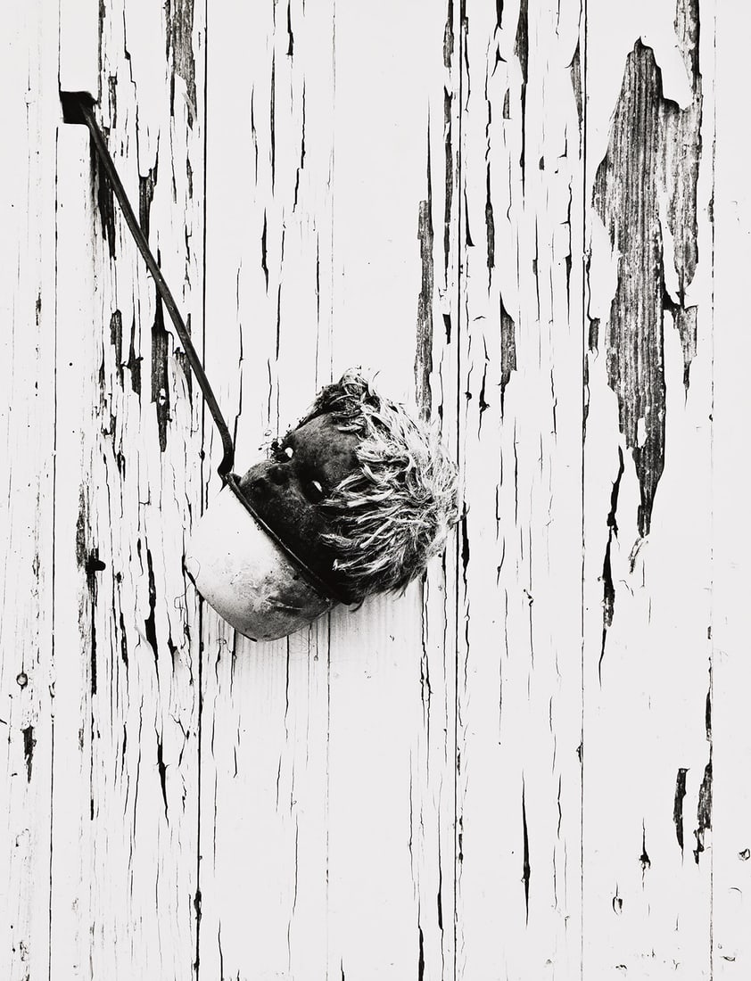 RALPH EUGENE MEATYARD (1925-1972) Doll's head.: RALPH EUGENE MEATYARD (1925-1972) Doll's head. Silver print, the image measuring 9x7 inches (24.8x19.1 cm.), the sheet slightly larger, with Madelyn O. Meatyard's signature in ink on verso. Circa 1959