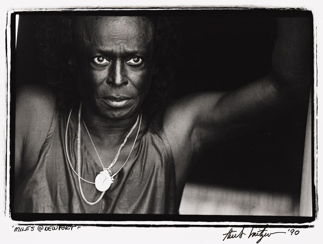 HERB SNITZER (1932-2022): Artist or author: HERB SNITZER (1932-2022) Title: "Miles @ Newport" / [Farewell Miles]. Description: Silver print, the image measuring 203x292 mm, 8x11½ inches, the sheet measuring 279x356