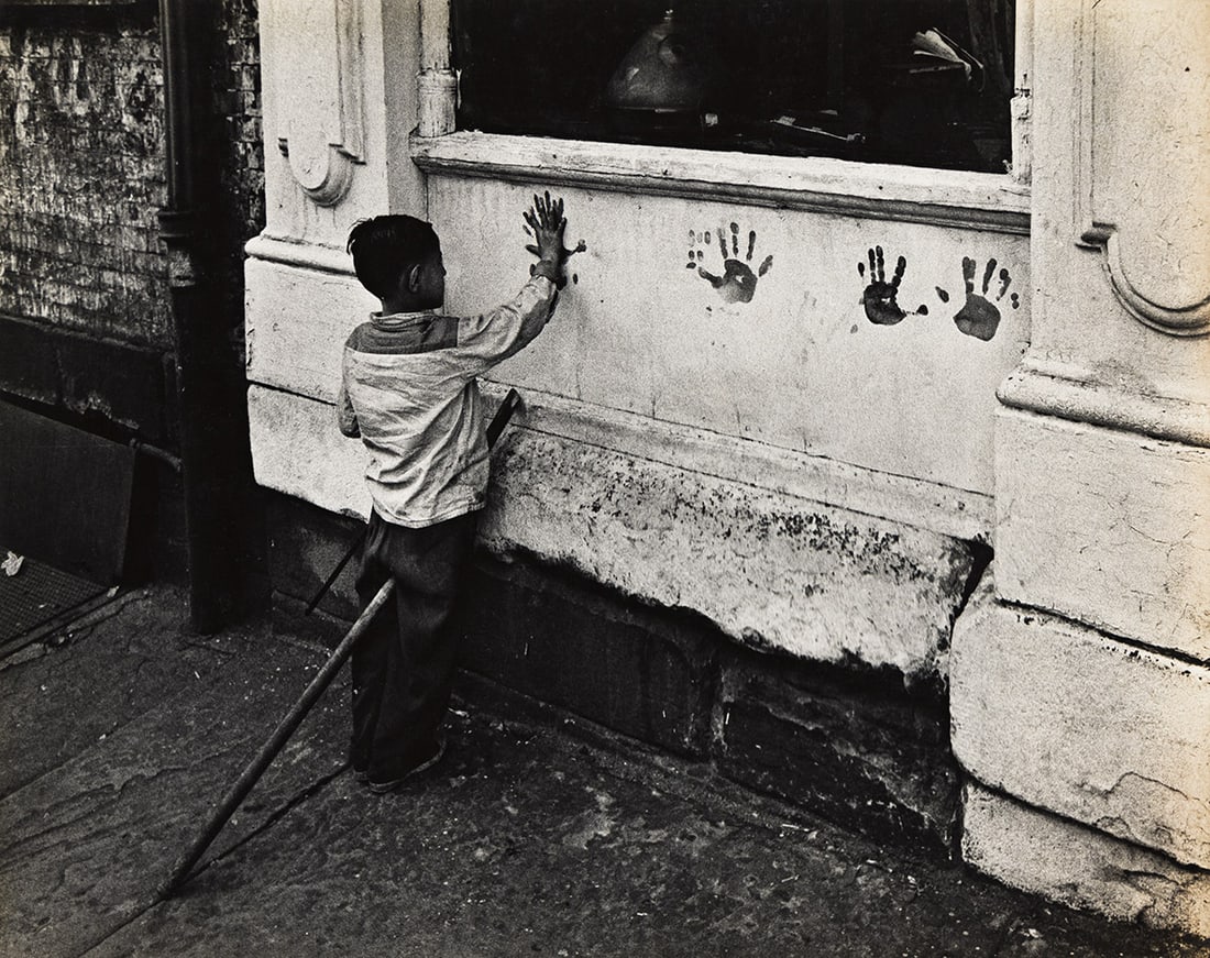 W. EUGENE SMITH (1918-1978) Child with Handprints, Pittsburgh.: W. EUGENE SMITH (1918-1978) Child with Handprints, Pittsburgh. Silver print, the image measuring 10½x13¼ inches (26.7x33.7 cm.), the mount 20x16 inches (50.8x40.6 cm.), with Smith's signatur