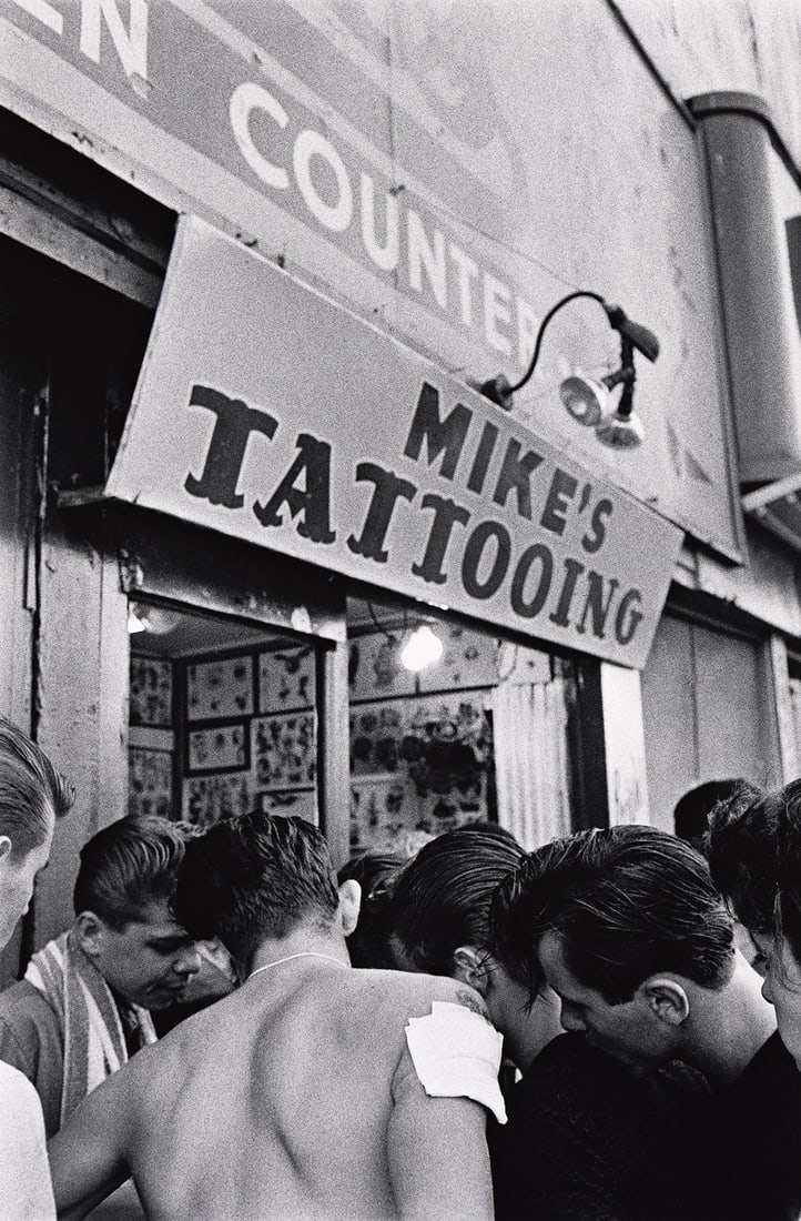 BRUCE DAVIDSON (1933- ) Mike's tattooing, from the series Brooklyn Gang.: BRUCE DAVIDSON (1933- ) Mike's tattooing, from the series Brooklyn Gang. Silver print, the image measuring 12¾x8½ inches (32.4x21.6 cm.), the sheet 14x11 inches (35.6x27.9 cm.), with Davidso