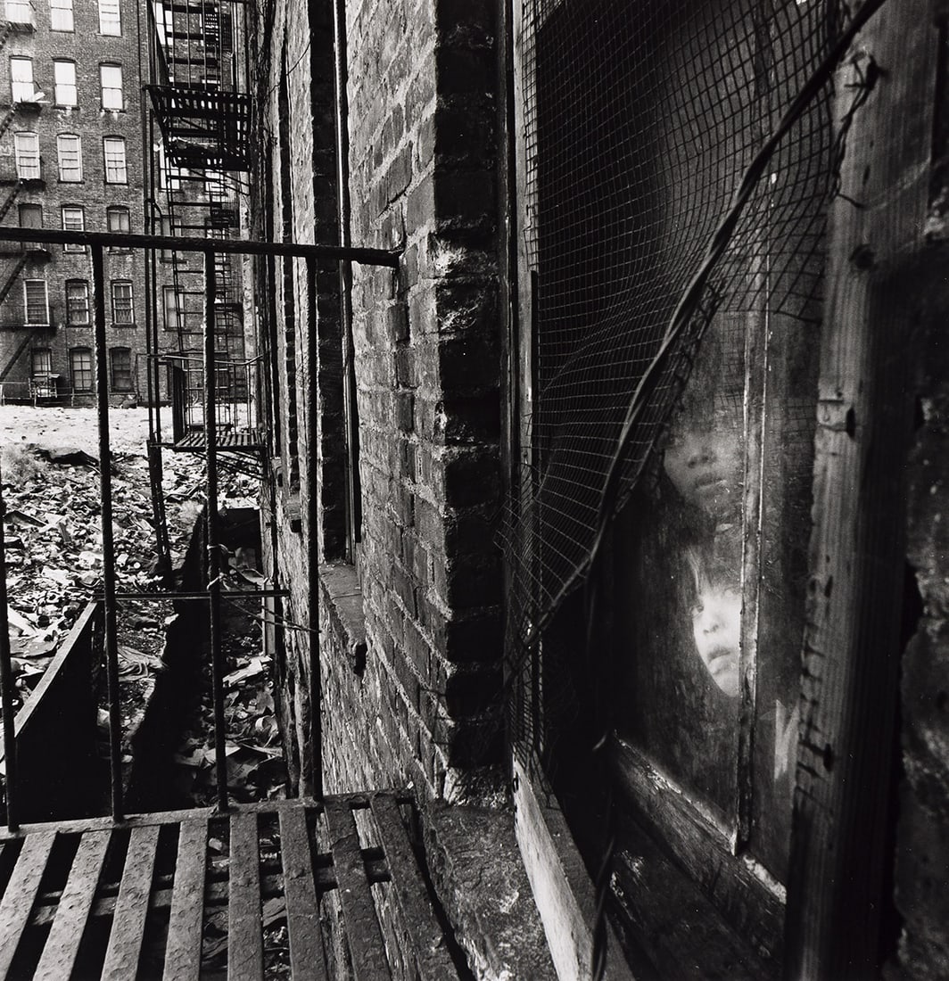 BRUCE DAVIDSON (1933- ) East 100th Street.: BRUCE DAVIDSON (1933- ) East 100th Street. Silver print, the image measuring 7⅝x7⅜ inches (19.4x18.7 cm.), the sheet 10x8 inches (25.4x20.3 cm.), with Davidson's signature and edition nota