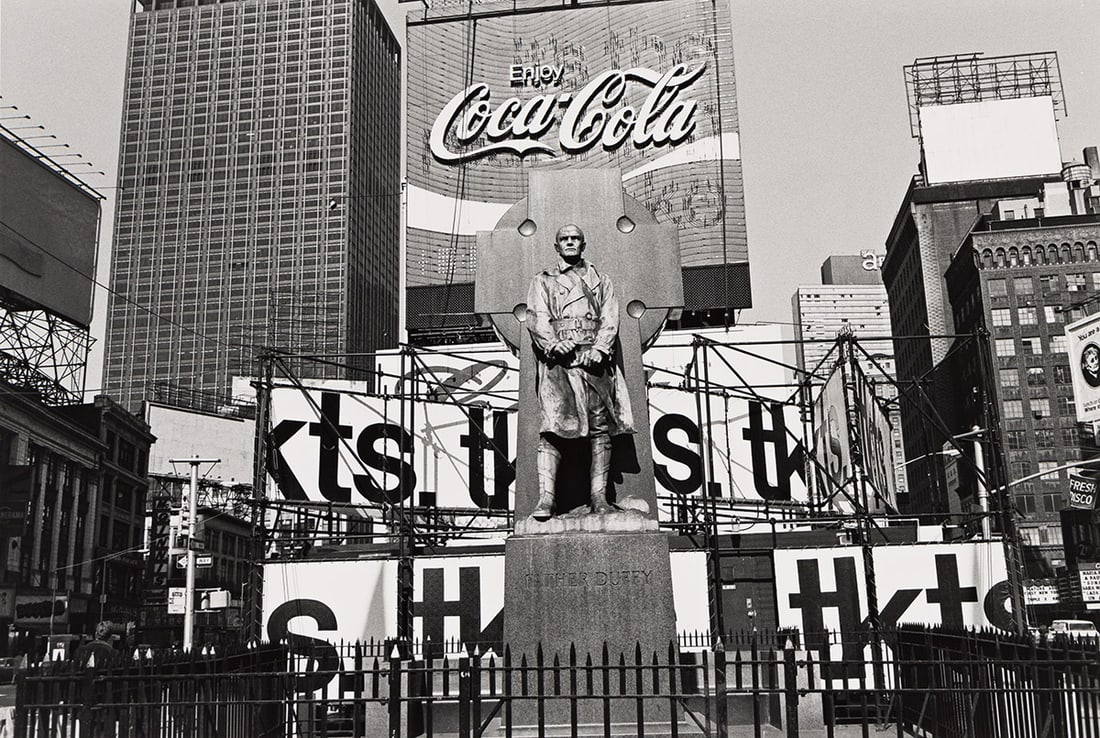 LEE FRIEDLANDER (1934- ) New York City (Father Duffy, Times Square). 1974; printed before 1978.: LEE FRIEDLANDER (1934- ) New York City (Father Duffy, Times Square). 1974; printed before 1978. Silver print, the image measuring 19½x28½ cm, 7⅝x11¼ inches, the sheet 28x35½