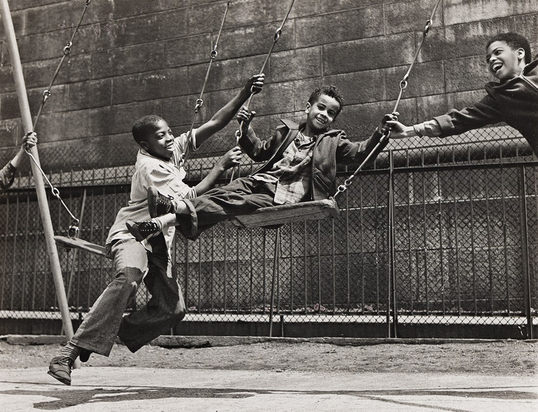 WALTER ROSENBLUM (1919-2006) Three Boys on a Swing, Pitt Street, NY. 1938; printed 1960s.: WALTER ROSENBLUM (1919-2006) Three Boys on a Swing, Pitt Street, NY. 1938; printed 1960s. Silver print, the image measuring 7½x9⅝ inches (19.1x24.4 cm.), the sheet slightly larger, flush mo