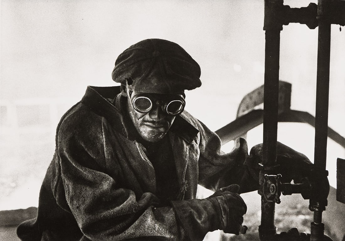 W. EUGENE SMITH (1918-1978) Welder, Pittsburgh. 1955-56; printed 1960s.: W. EUGENE SMITH (1918-1978) Welder, Pittsburgh. 1955-56; printed 1960s. Silver print, the image measuring 6x8½ inches (15.2x21.6 cm.), the sheet 8x10 inches (20.3x25.4 cm.), with Smith's credit,