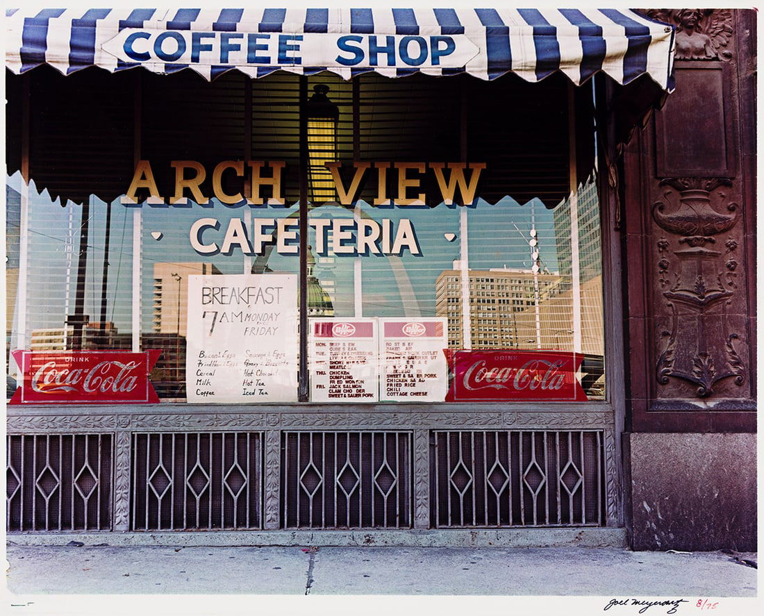 JOEL MEYEROWITZ (1938- ) Arch View Cafeteria, from the portfolio St. Louis and the Arch. 1977.: JOEL MEYEROWITZ (1938- ) Arch View Cafeteria, from the portfolio St. Louis and the Arch. 1977. Dye transfer print, the image measuring 15⅜x19⅝ inches (39.1x49.8 cm.), the sheet slightly la