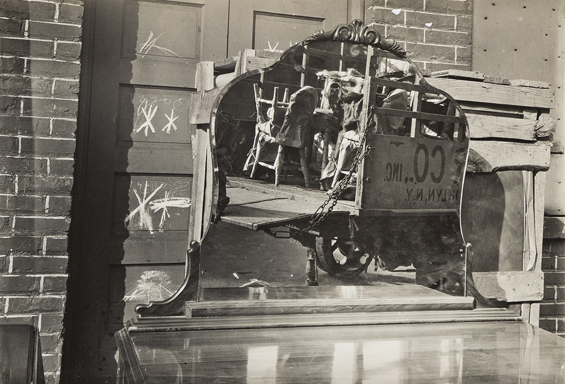 WALKER EVANS (1903-1975) Moving Truck and Bureau Mirror, Brooklyn. 1929; likely printed late 1930s.: WALKER EVANS (1903-1975) Moving Truck and Bureau Mirror, Brooklyn. 1929; likely printed late 1930s. Silver print, the image measuring 4⅝x6⅝ inches (11.7x16.8 cm.), the sheet slightly large
