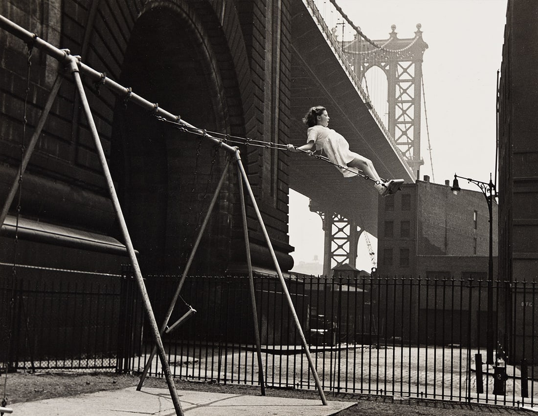 WALTER ROSENBLUM (1919-2006) Girl on Swing, Pitt Street, New York. 1938; printed 1960s.: WALTER ROSENBLUM (1919-2006) Girl on Swing, Pitt Street, New York. 1938; printed 1960s. Silver print, the image measuring 7x9⅛ inches (17.8x23.2 cm.), the sheet lightly larger, flush mounted, wi
