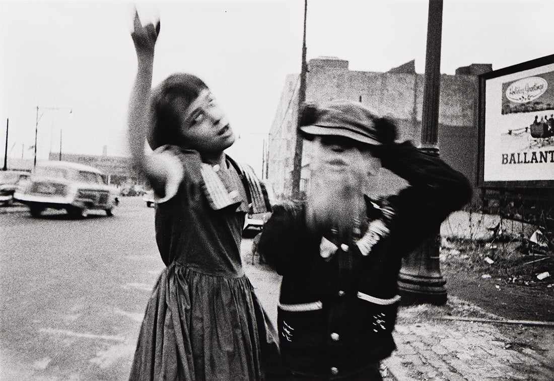 WILLIAM KLEIN (1926-2022) Dance in Bensonhurst, NY. 1955; printed 1977.: WILLIAM KLEIN (1926-2022) Dance in Bensonhurst, NY. 1955; printed 1977. Silver print, the image measuring 9x13 inches (22.9x33 cm.), the sheet 11½x16 inches (29.2x40.6 cm.), with Klein's signatur