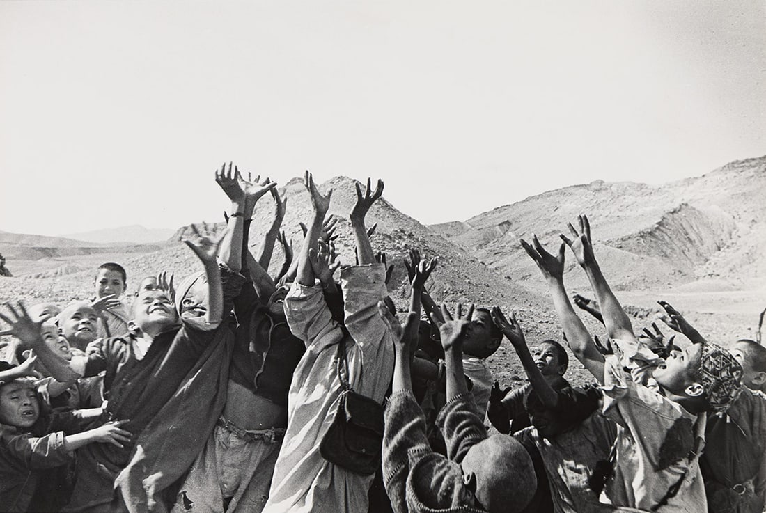 ESTHER BUBLEY (1921-1998) Group of children, hands reaching up, Morocco. Circa 1953.: ESTHER BUBLEY (1921-1998) Group of children, hands reaching up, Morocco. Circa 1953. Silver print, the image measuring 9⅛x13⅜ inches (23.2x34 cm.), with Bubley's signature in pencil and st