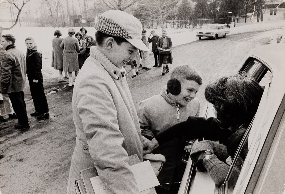 ROBERT FRANK (1924-2019) New York Is (Suburban mothers are often kept busy as "chauffeurs").: ROBERT FRANK (1924-2019) New York Is (Suburban mothers are often kept busy as "chauffeurs"). 1958-59. Silver print, the image measuring 8¼x12 inches (21x30.5 cm.), with Frank's credit in ink and
