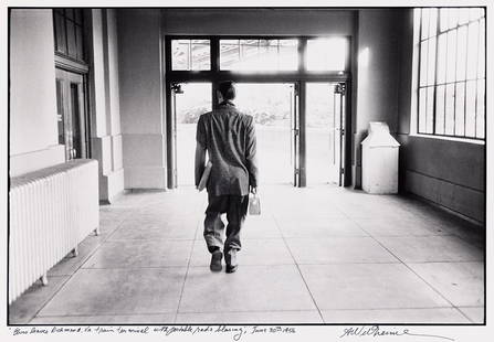 ALFRED WERTHEIMER (1929-2014) Elvis leaves Richmond, VA train terminal with portable radio blaring.: ALFRED WERTHEIMER (1929-2014) Elvis leaves Richmond, VA train terminal with portable radio blaring. June 1956; printed 1979. Silver print, the image measuring 10x14⅞ inches (25.4x37.8 cm.), the