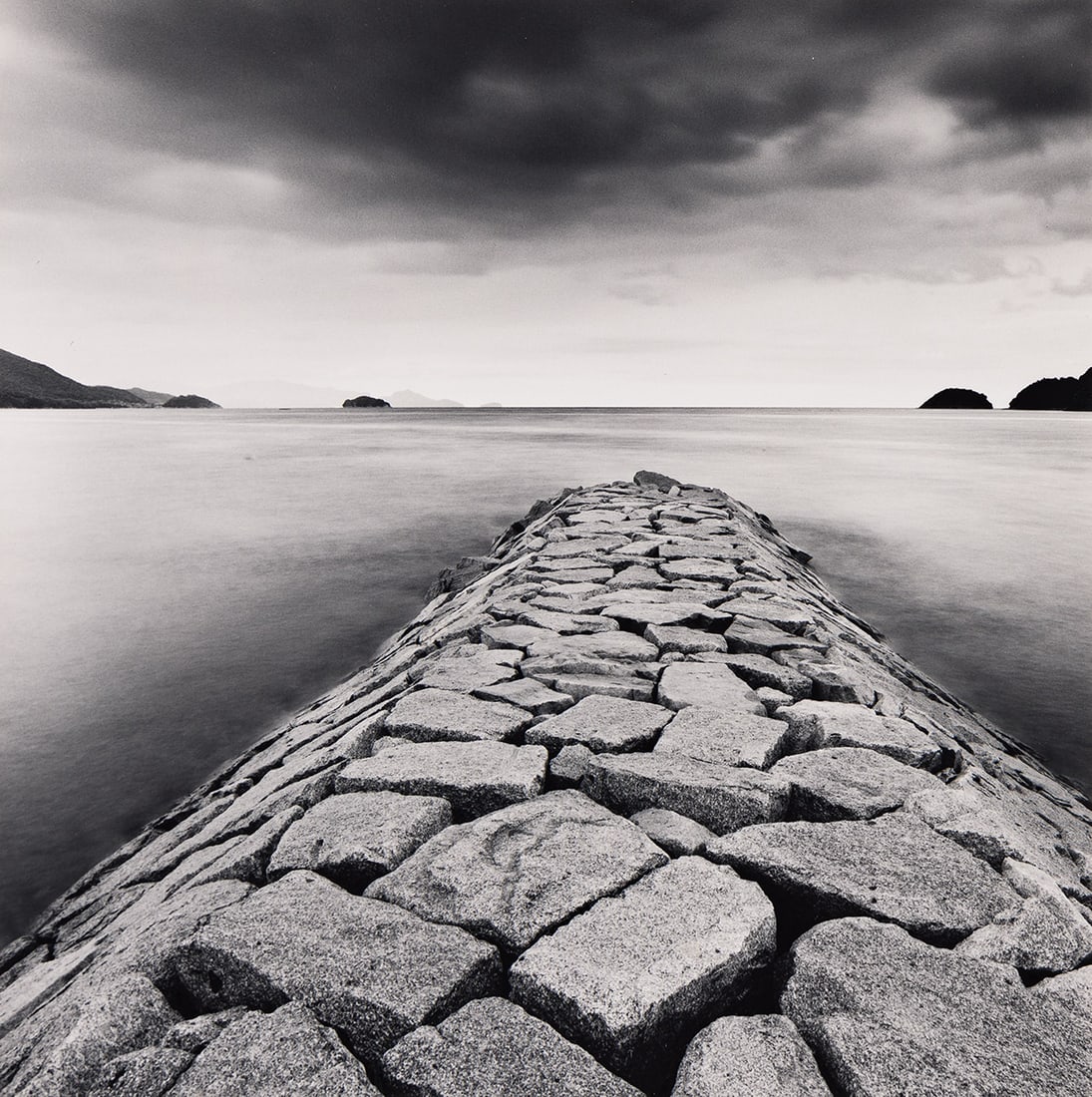 MICHAEL KENNA (1953- ) Rocky Pier, Tsuada, Shikoku, Japan. 2001; printed 2002.: MICHAEL KENNA (1953- ) Rocky Pier, Tsuada, Shikoku, Japan. 2001; printed 2002. Silver print, the image measuring 7½ inches (19.1 cm.) square, the mount 20x16 inches (50.8x40.6 cm.), with Kenna