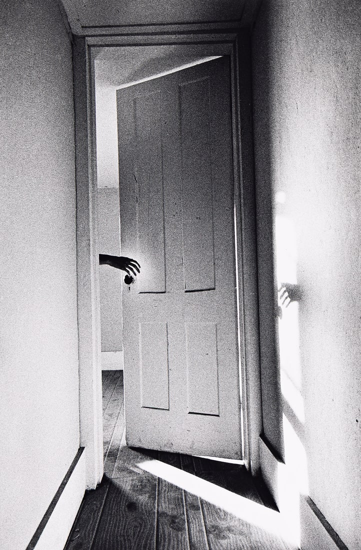 RALPH GIBSON (1939- ) Hand Through Doorway. 1969; printed 1980s.: RALPH GIBSON (1939- ) Hand Through Doorway. 1969; printed 1980s. Silver print, the image measuring 12⅜x8⅛ inches (31.2x21 cm.), the sheet 14x11 inches (35.6x27.9 cm.), with Gibson's signat