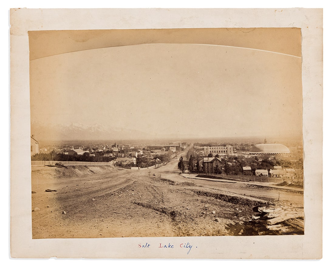 (MORMONS.) [Carleton E. Watkins, photographer?] Early view of Salt Lake City.: (MORMONS.) [Carleton E. Watkins, photographer?] Early view of Salt Lake City. Albumen print, 7½ x 10 inches, laid down on stiff paper, captioned "Salt Lake City" in red and blue in manuscript; mi