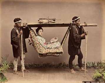 A beautiful Japanese album with 100 hand-colored photographs. 1880s.