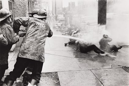 Charles Moore. Demonstrators Lie on the Sidewalk While Firemen Hose Them, Birmingham Protests. May