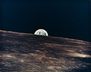 A spectacular NASA photograph of the Earthrise over the Moon, possibly Apollo 10 or 11. 1969.