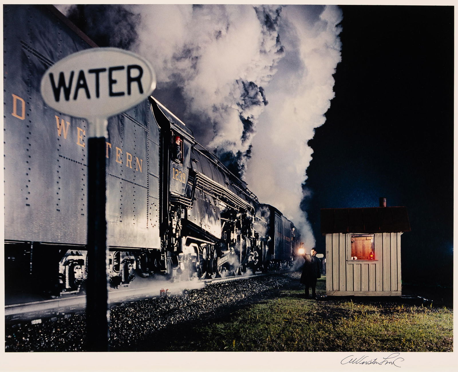 O. Winston Link. Highball for the Double Header, Roanoke, Virginia. 1959; printed 1970s.: O. Winston Link1914-2001Highball for the Double Header, Roanoke, Virginia. 1959; printed 1970s.Chromogenic printWith Link's signature in ink on recto.The image 13 7/8 x 18 in. (35.2 x 45.7 cm.), the s