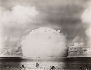 A group of 14 official photographs of nuclear testing and atomic bomb explosions at Bikini Atoll.