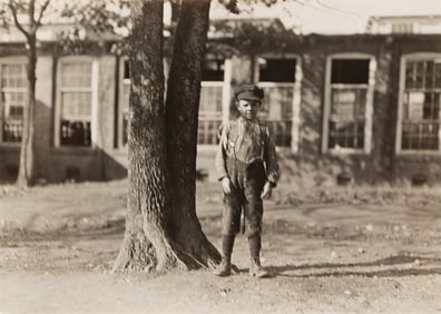 Lewis W. Hine. One of the smallest doffers in the Atherton Mill, Charlotte, NC. January 1909.