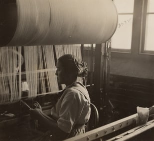 Lewis W. Hine. Girl at the drawing-in-frame of the weave-room, Lorraine Mills, Pawtucket, RI. 1912.