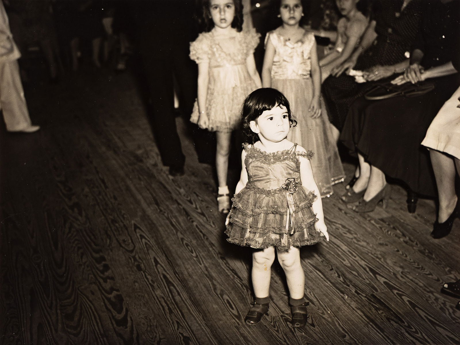 Jack Delano. Untitled (little girl in dress). 1942.: Jack Delano1914-1997Untitled (little girl in dress). 1942.Silver printWith Delano's signature and numeric notations in pencil, and a Library of Congress copyright stamp on verso.The image 7 1/8 x 9 1/