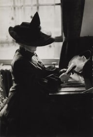 Inge Morath. Mrs. Eveleigh Nash, seated and reviewing her engagement book. 1953.