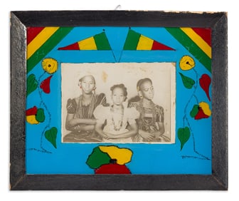 Malick Sidibé. rtrait presented in Sidibé's custom frame with colorful reverse painted
