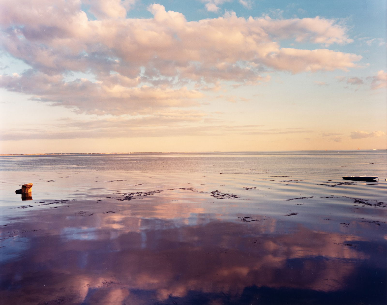 Joel Meyerowitz. From the Bay/Sky series, Provincetown. 1993.: Joel Meyerowitz1938-From the Bay/Sky series, Provincetown. 1993.Chromogenic printWith Meyerowitz's signature and date in ink on verso.The image 9 x 11 3/8 in. (22.9 x 28.9 cm.), the sheet slightly lar