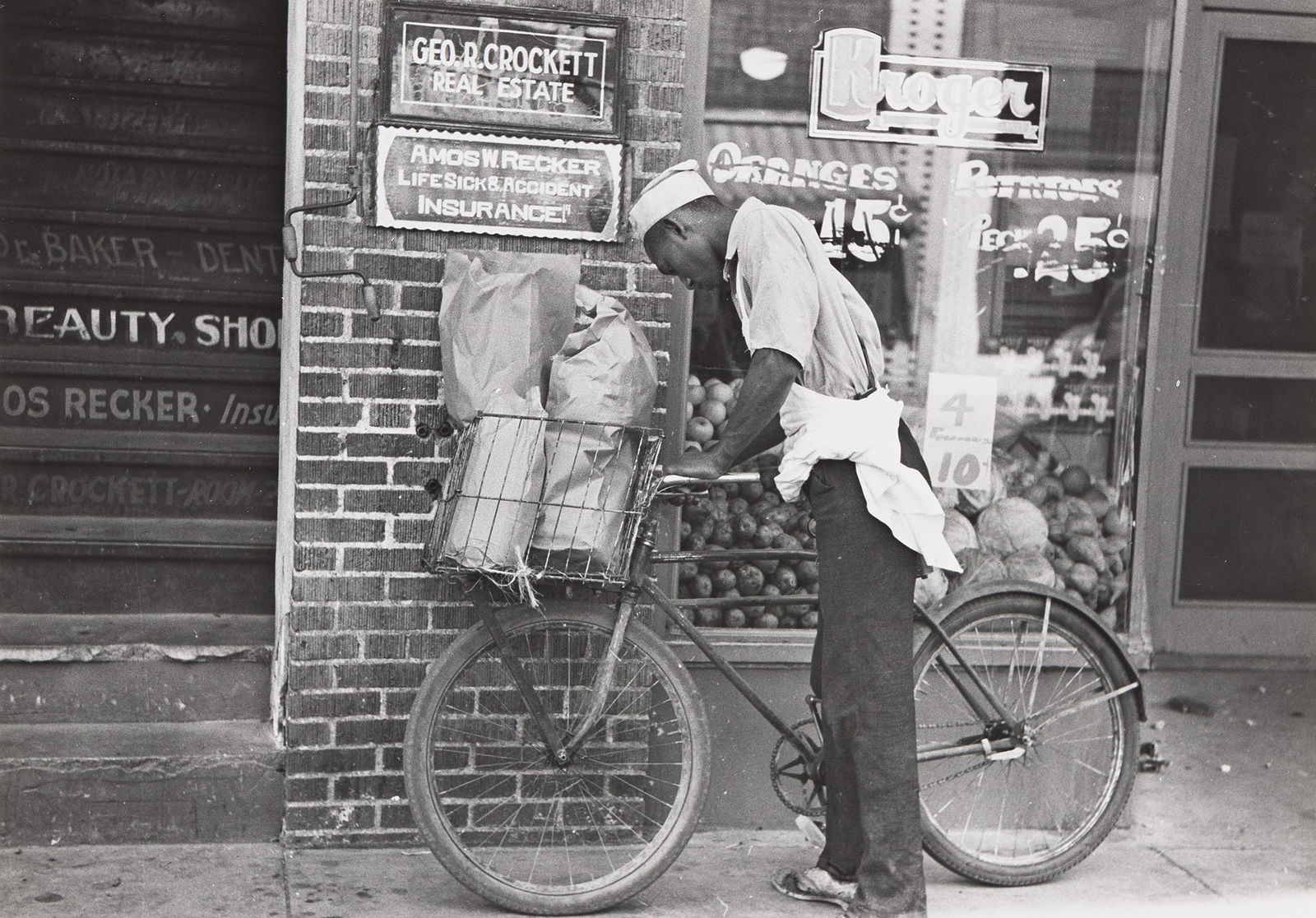 Russell Lee, Negro delivery boy, Caruthersville, Missouri, August 1938; printed circa 1970.: Russell Lee(1903-1986)Negro delivery boy, Caruthersville, Missouri. August 1938; printed circa 1970.Silver print.With the Library of Congress stamp, a typed notation, and Lee's credit, title, negative