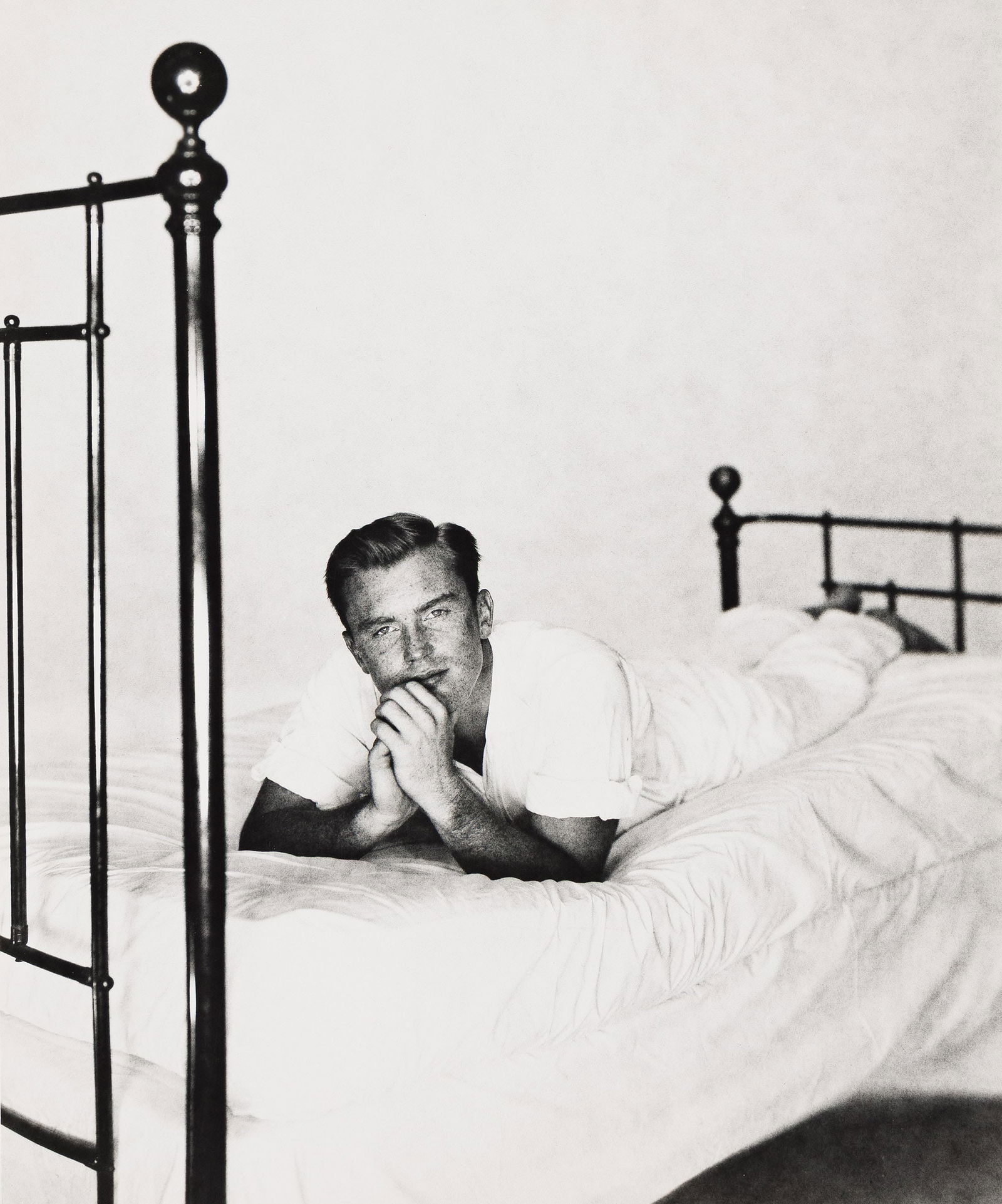 George Platt Lynes, Alexander Jensen Yow on Bed. Circa 1952.: George Platt Lynes1907-1955Alexander Jensen Yow on Bed. Circa 1952.Silver printWith Lynes' credit stamp on verso.The image 9 1/8 x 7 1/2 in. (23.2 x 19.1 cm.)