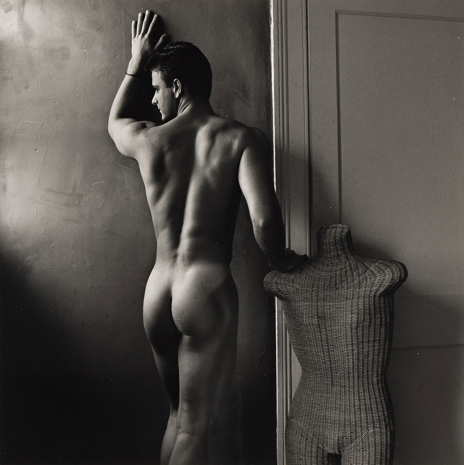 Robert Giard, Male Nude, Rearview, Wicker Torso. 1990.: Robert Giard1939-2002Male Nude, Rearview, Wicker Torso. 1990.Silver printThe image 14 1/8 in. (35.9 cm.) square, the sheet 19 3/4 x 15 3/4 in. (50.2 x 40 cm.) Provenance:Acquired directly from t