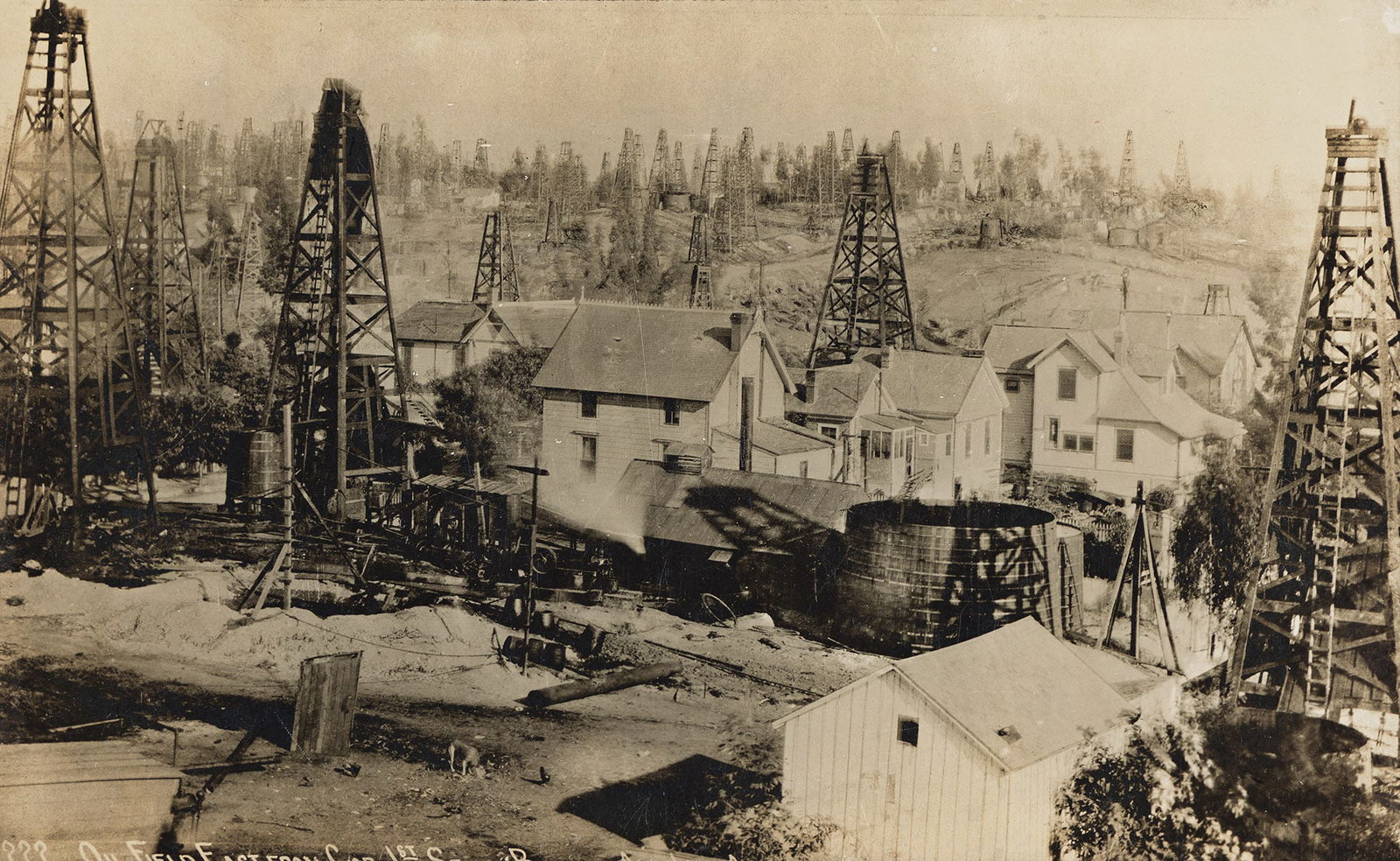 Oil Wells and House, Looking East from First Street, Los Angeles. Circa 1910. (1 of 1)