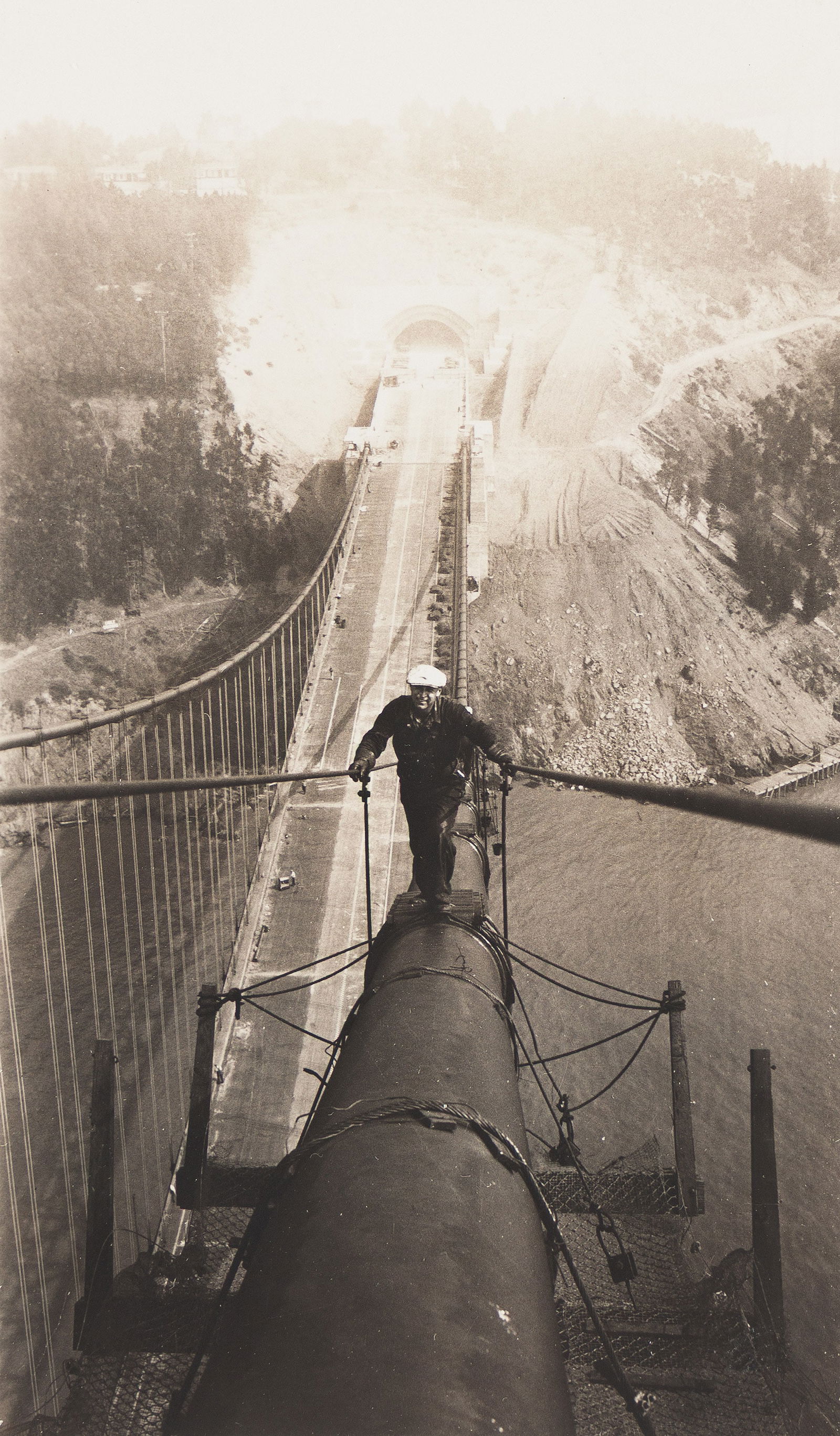 A suite of 4 snapshots depicting workers on top of the San Francisco-Oakland Bay Bridge. Circa 1935. (1 of 4)