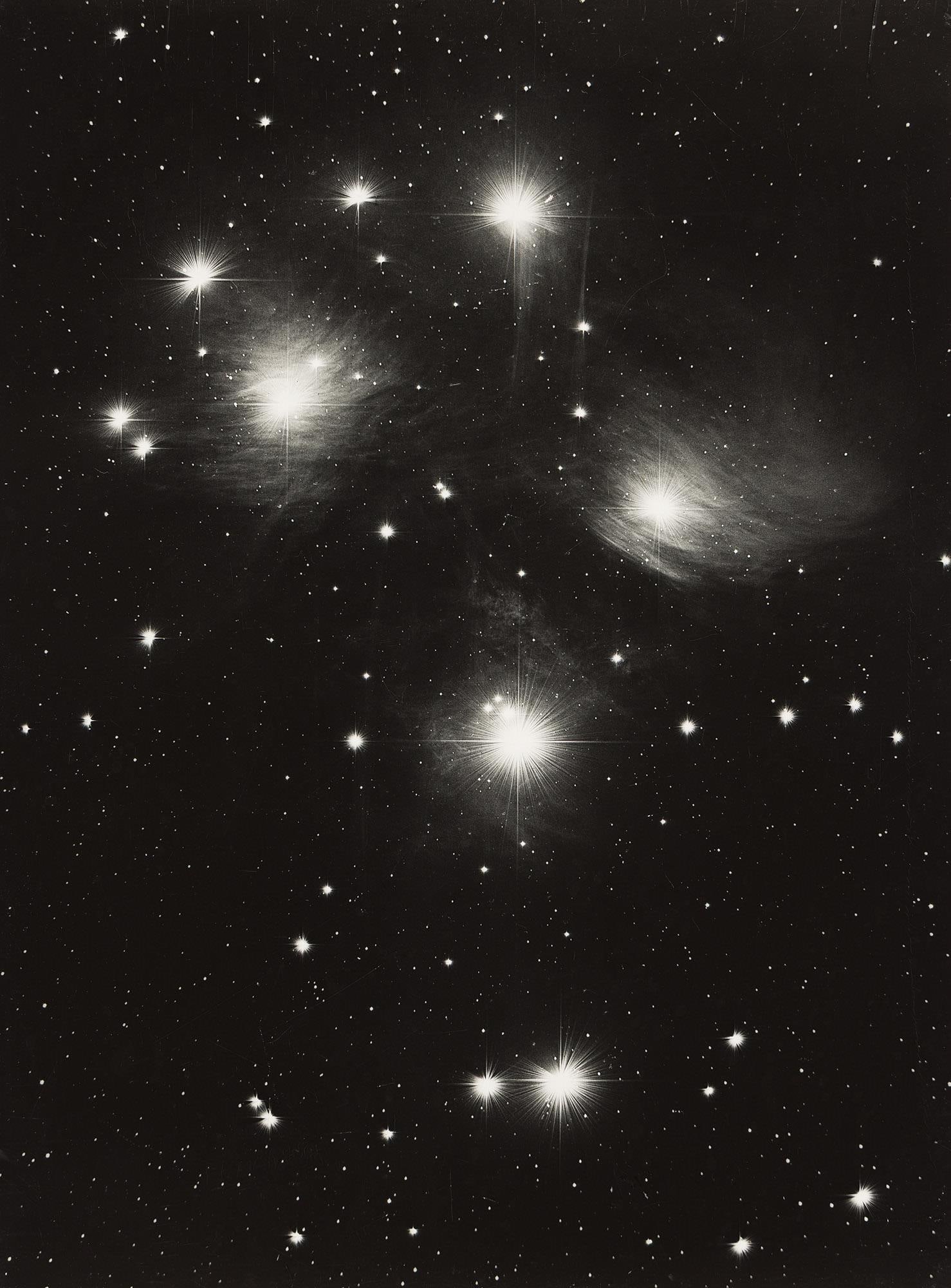 Pleiades Constellation. By Palomar Observatory and possibly printed by Ansel Adams before 1955.: Pleiades Constellation. From Palomar Observatory and possibly printed by Ansel Adams before 1955.Silver printWith a numeric notation in ink in an unknown hand on verso.The image 19 1/4 x 14 1/4 in. (4