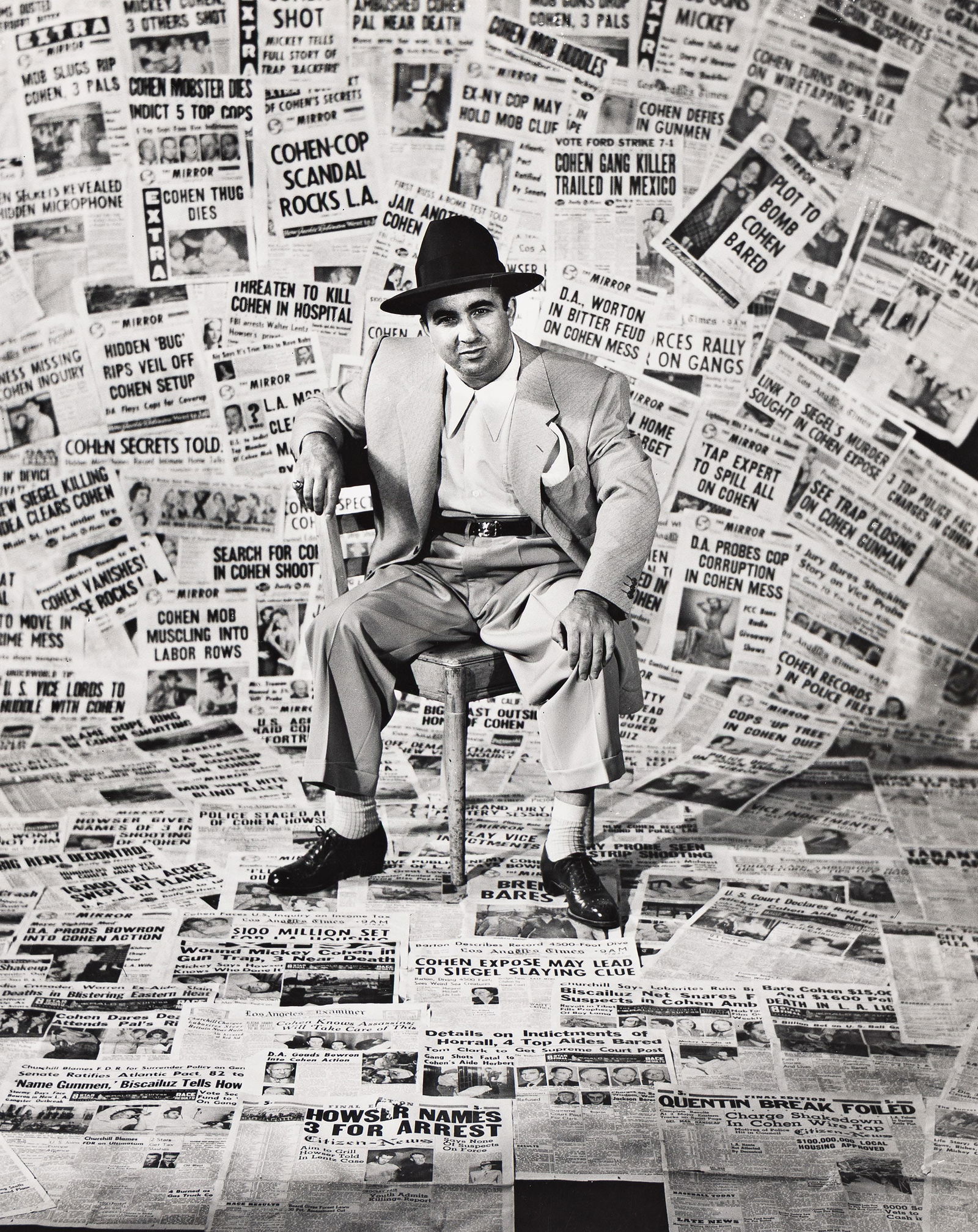 Edward Clark. Gangster Mickey Cohen sits with L.A. papers that denounce him. 1949. (1 of 1)