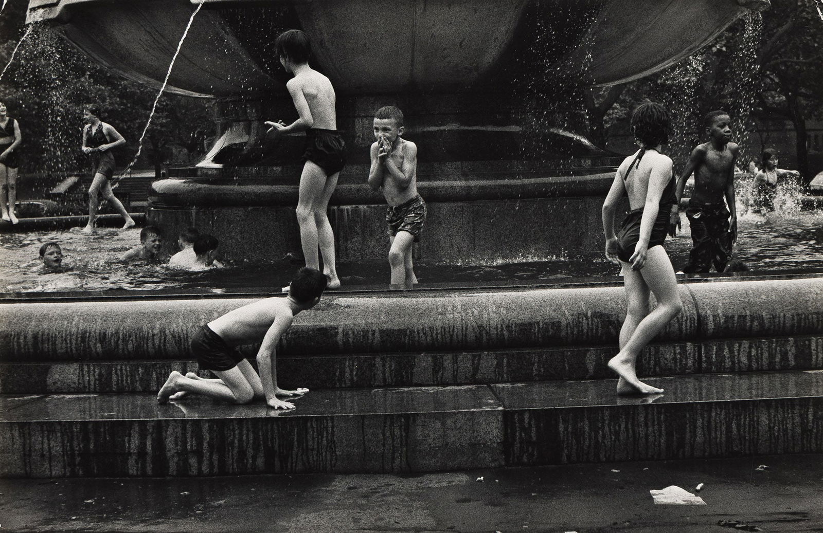 W. Eugene Smith. Children Playing near Fountain, Schenley Park, Pittsburgh. Circa 1956; printed: W. Eugene Smith1918-1978Children Playing near Fountain, Schenley Park, Pittsburgh. Circa 1956; printed 1960s.Silver printWith Smith's Croton-on-Hudson credit stamp, a Stefan Lorant Collection stamp, a