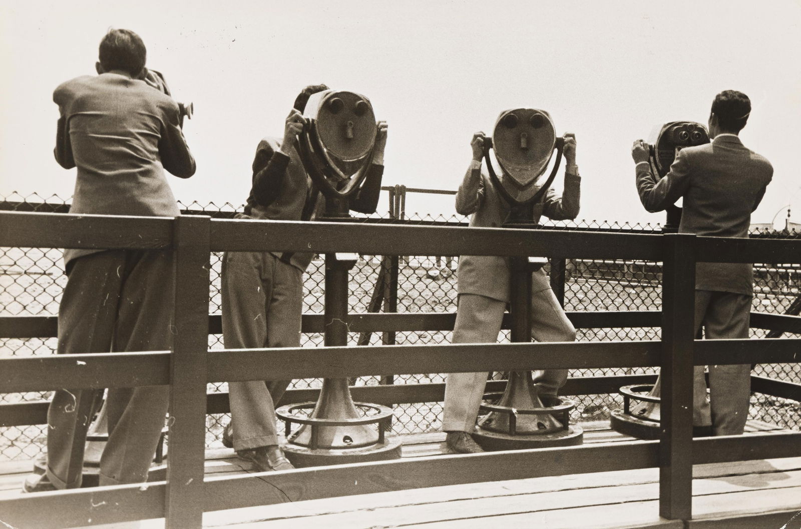Ernst Haas. Tower viewers, people with binoculars, New York. 1950s.: Ernst Haas1921-1986Tower viewers, people with binoculars, New York. 1950s.Silver printWith Haas' copyright stamp and the later Ernst Haas Studio Inc. stamp, and an Agent Japan label, on verso.The imag