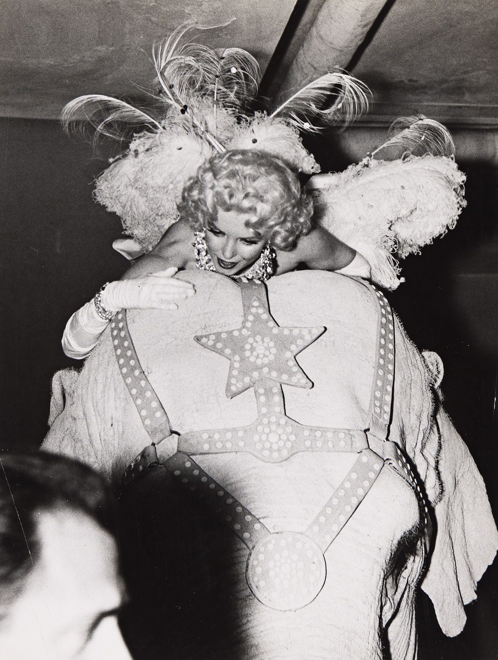 Weegee [Arthur Fellig]. Marilyn Monroe riding an elephant. Circa 1955. (1 of 1)