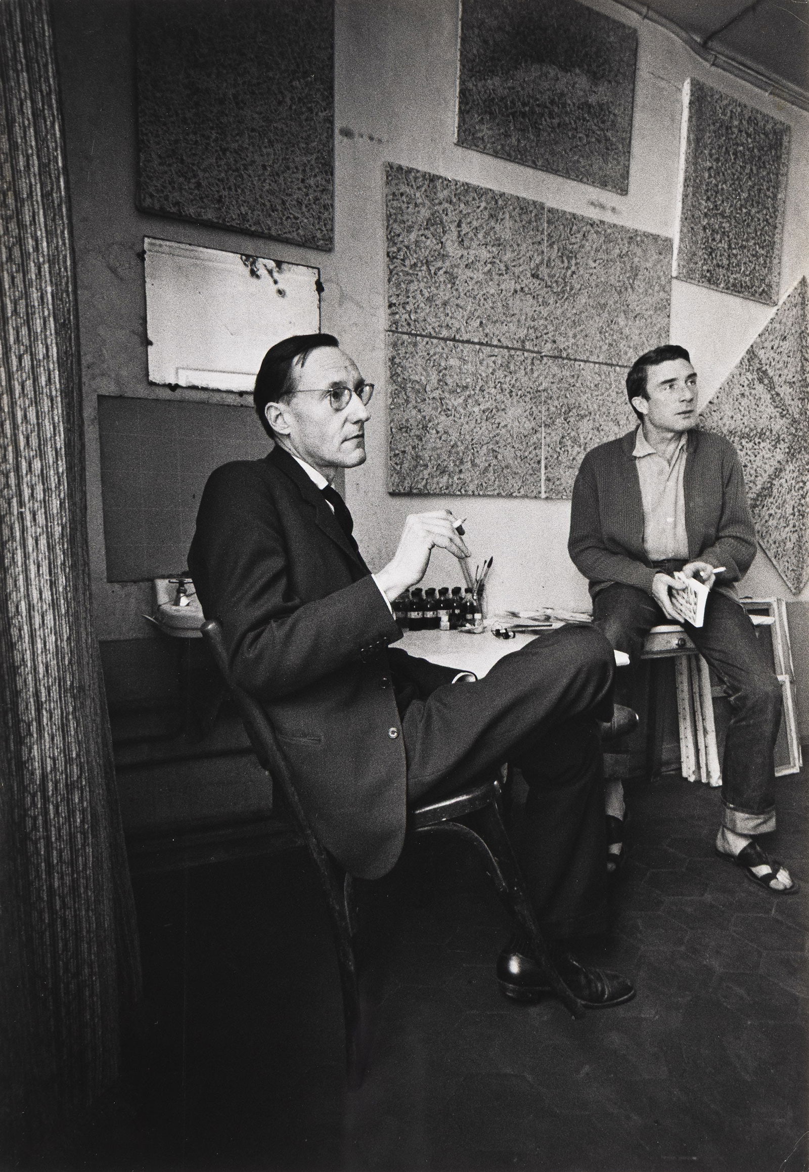 Loomis Dean. William S. Burroughs and Brion Gysin at the Beat Hotel, Paris. 1959.: Loomis Dean1917-2005William S. Burroughs and Brion Gysin at the Beat Hotel, Paris. 1959.Silver printWith Loomis' credit and copyright stamps on verso.The image 13 3/8 x 9 1/4 in. (34 x 23.5 cm.)