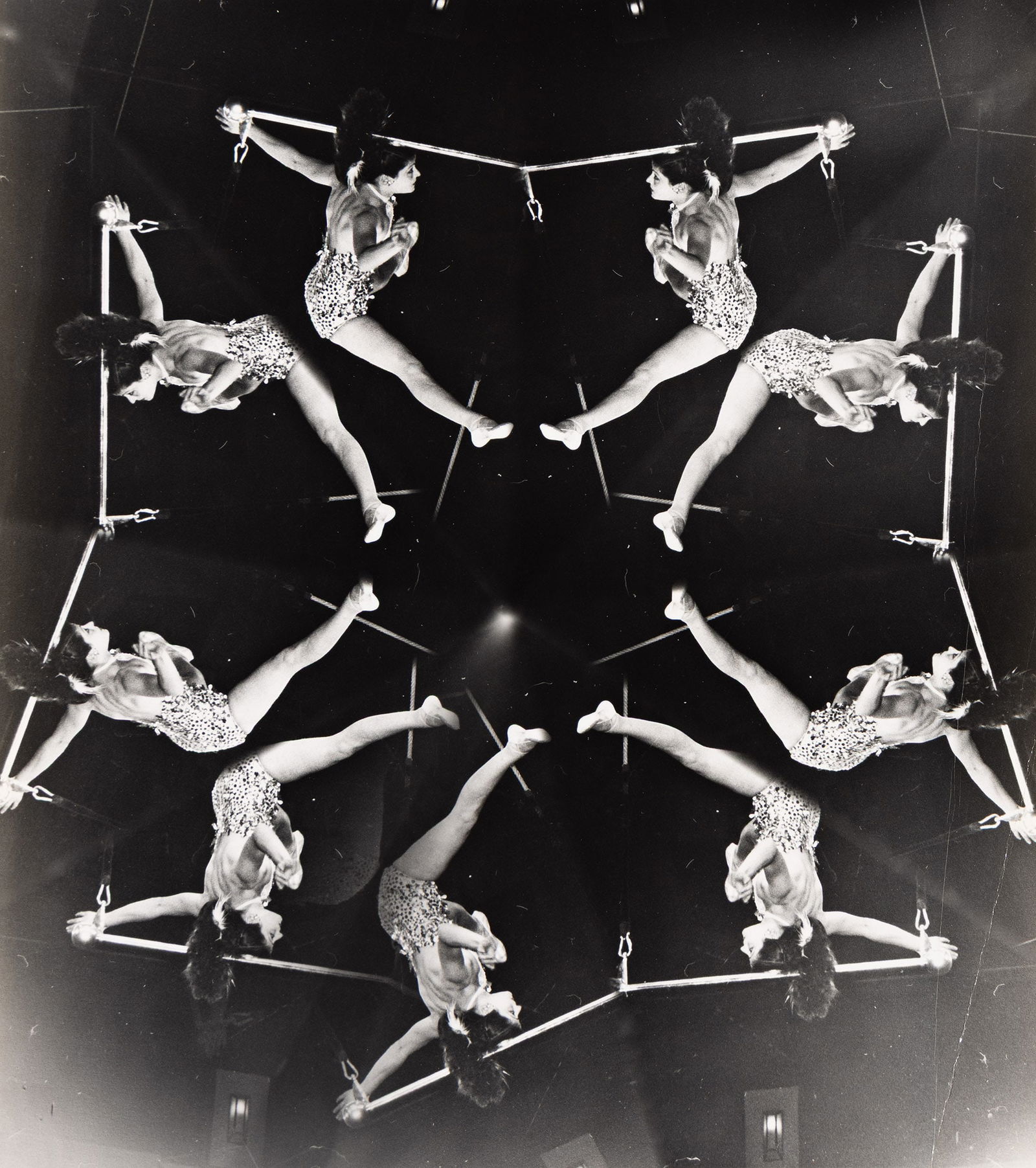 Weegee [Arthur Fellig]. Circus Acrobat. Circa 1950s.: Weegee [Arthur Fellig]1899-1968Circus Acrobat. Circa 1950s.Silver ferrotyped printWith Weegee's Photo-Representatives credit stamp on verso.The image 9 1/8 x 8 in. (23.2 x 20.3 cm.), the sheet slightl