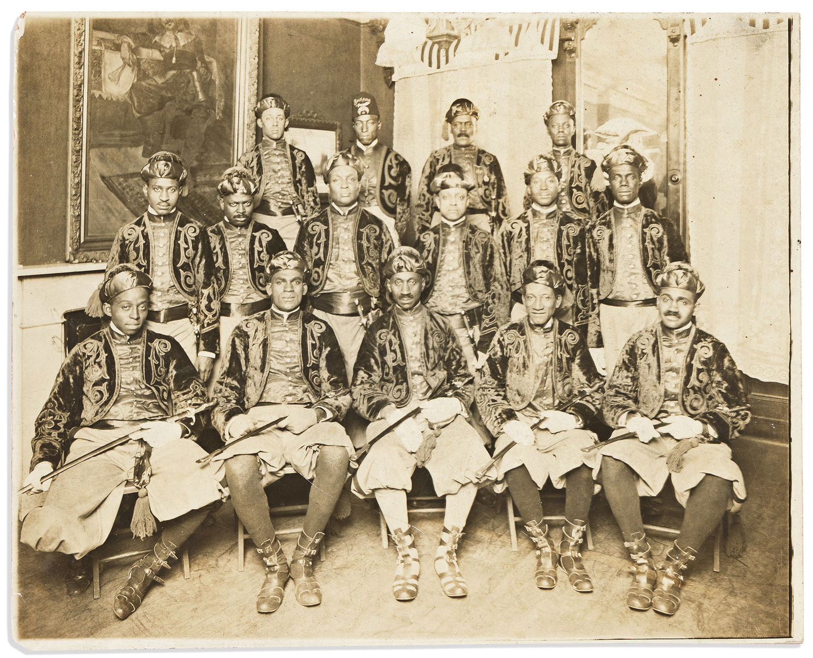 (FRATERNAL.) Photograph of a Pittsburgh Shriners group, with brochure for their Syria Mosque, 1928: (FRATERNAL.)Photograph of a Pittsburgh Shriners group, with brochure for their Syria Mosque "amusement temple."Pittsburgh, PA, 1928 and undatedPhotograph, 8 x 10 inches, on original plain mount; minor